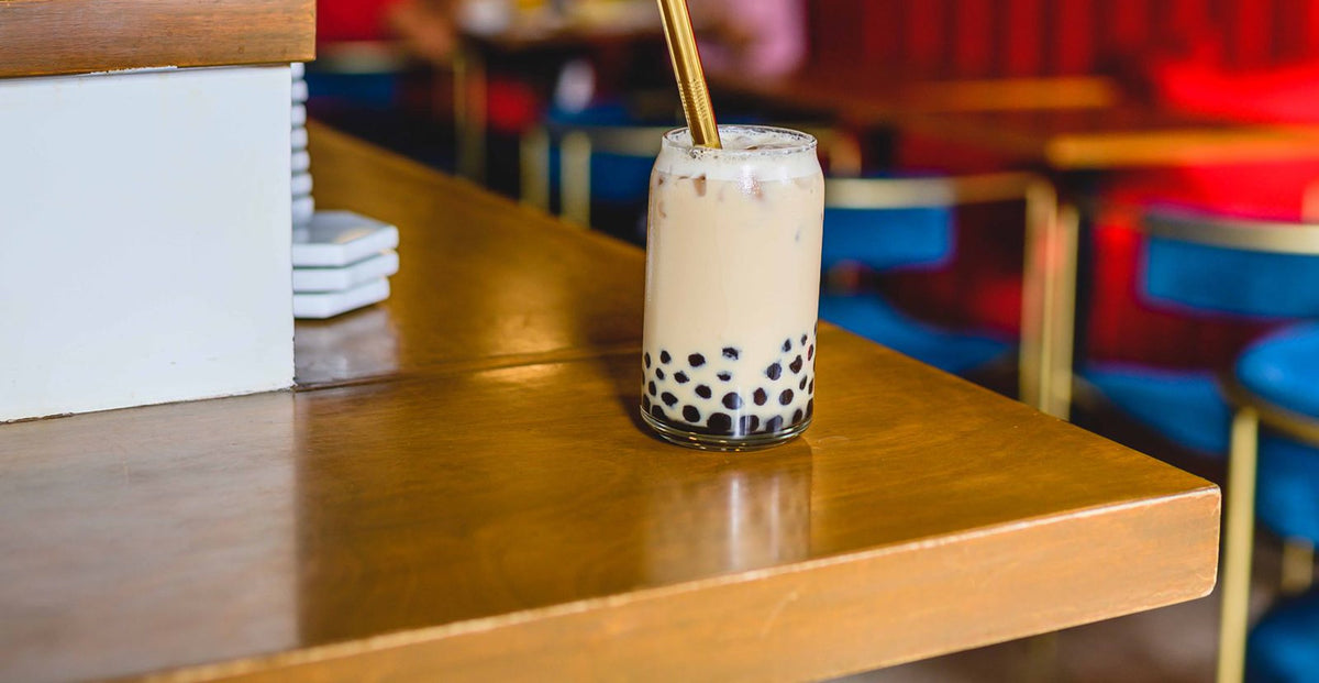 Bubble tea with chewy toppings at the bottom of the glass