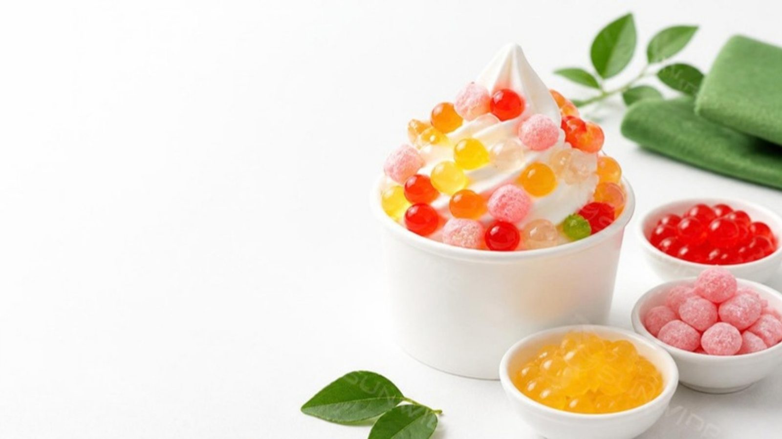 Frozen yoghurt cup topped with popping pearls, rainbow jelly and mini mochi